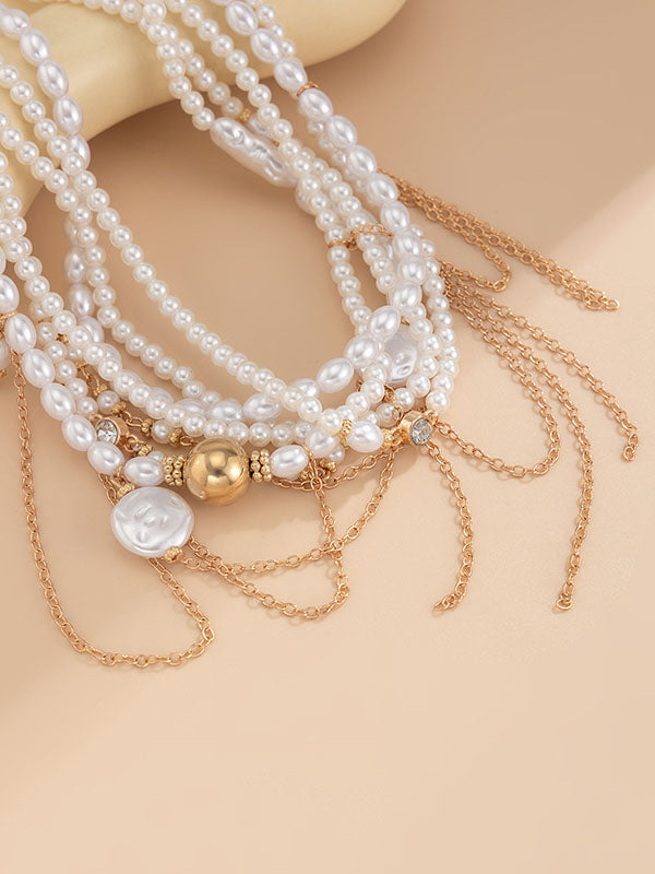 Collier géométrique superposé à pompons