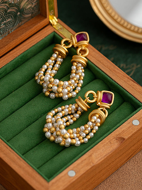 Boucles d'oreilles pendantes géométriques à pompons