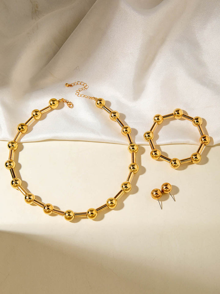 Parure collier et boucles d'oreilles géométrique couleur unie