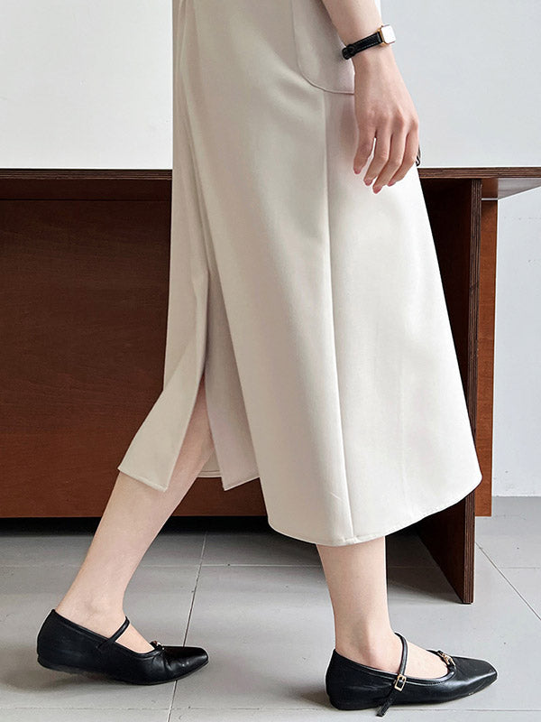 Robe mi-longue ample fendue dans le dos taille haute, à poches, à fermeture éclair, à col rond, couleur unie