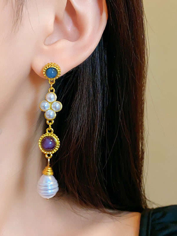 Boucles d'oreilles pendantes géométriques à pompons