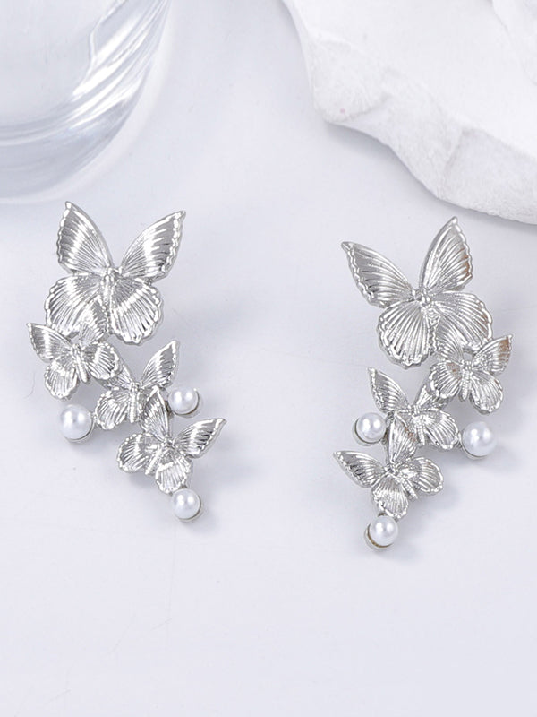 Boucles d'oreilles brillantes en forme de papillon