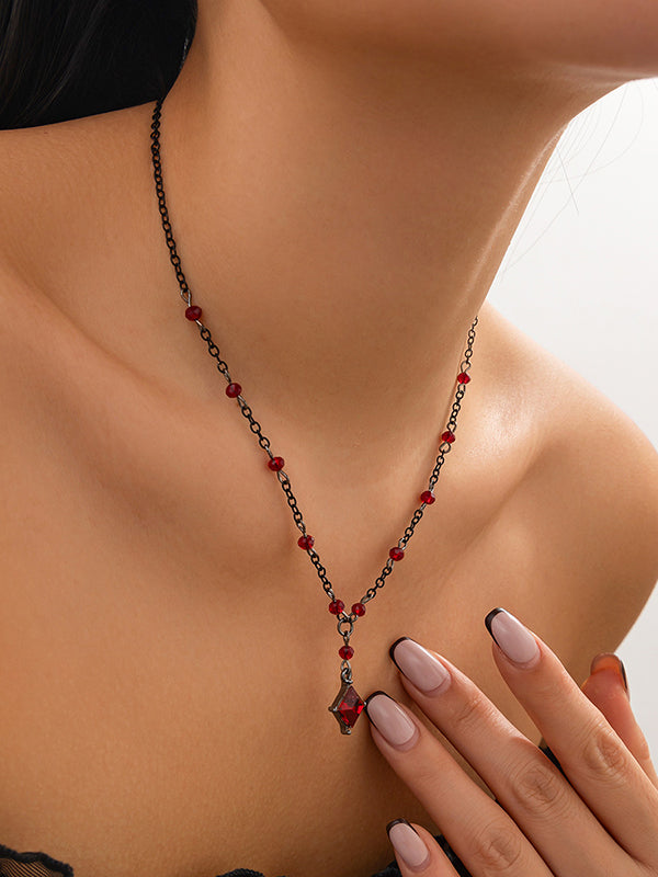 Collier géométrique à pompons