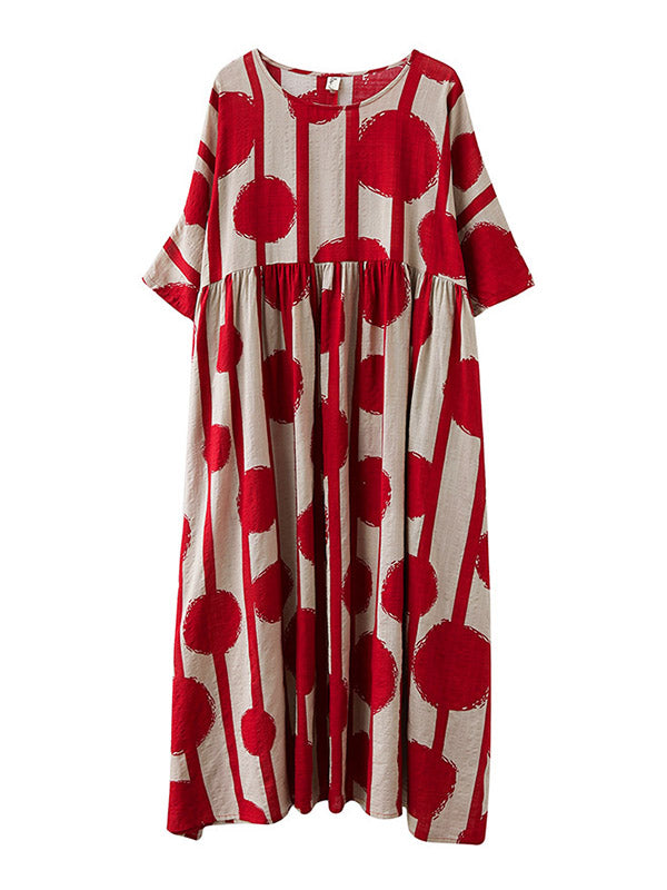 Robe mi-longue à pois, à empiècements, à col rond