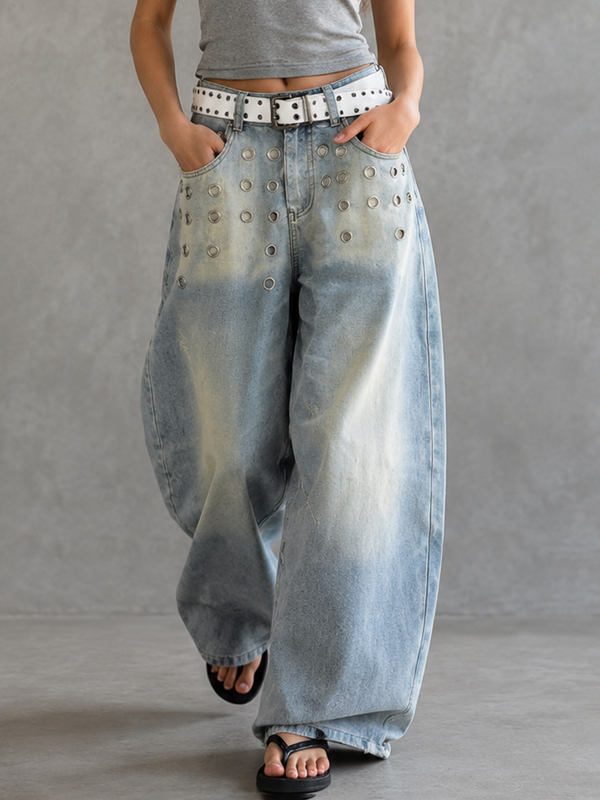 Jean ajouré taille haute, à jambes larges, à boucle de ceinture, à poches, à empiècements, couleur unie