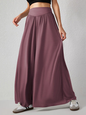 Pantalon ample plissé taille haute, à poches, à empiècements, couleur unie