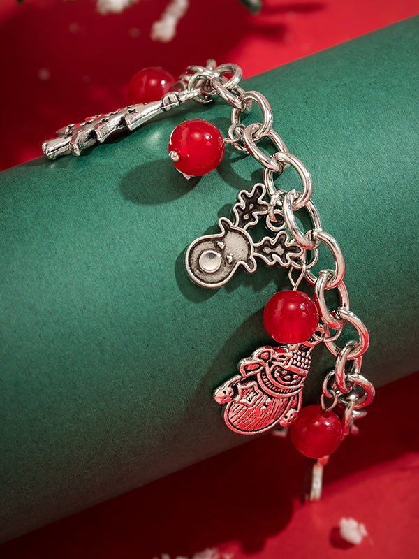 Bracelet géométrique à pompons