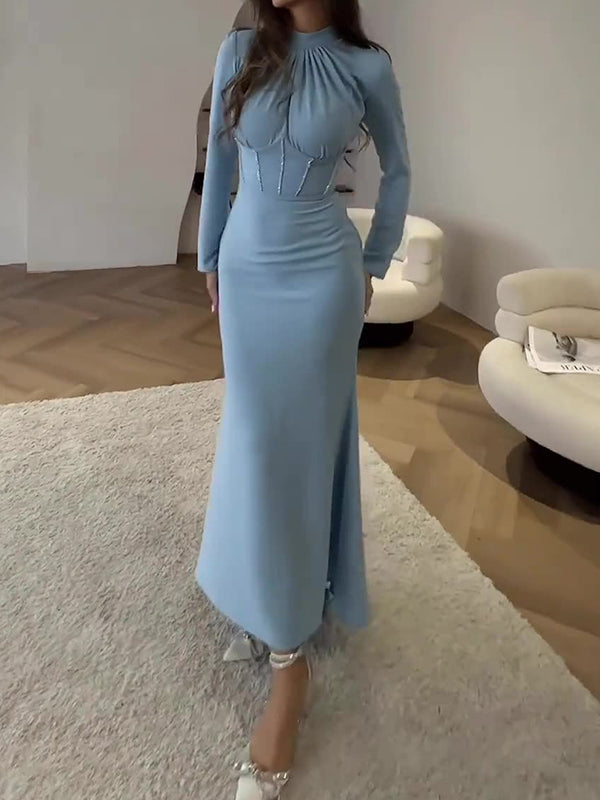 Robe longue moulante plissée nouée à manches longues, à fermeture éclair, à col cheminée, couleur unie