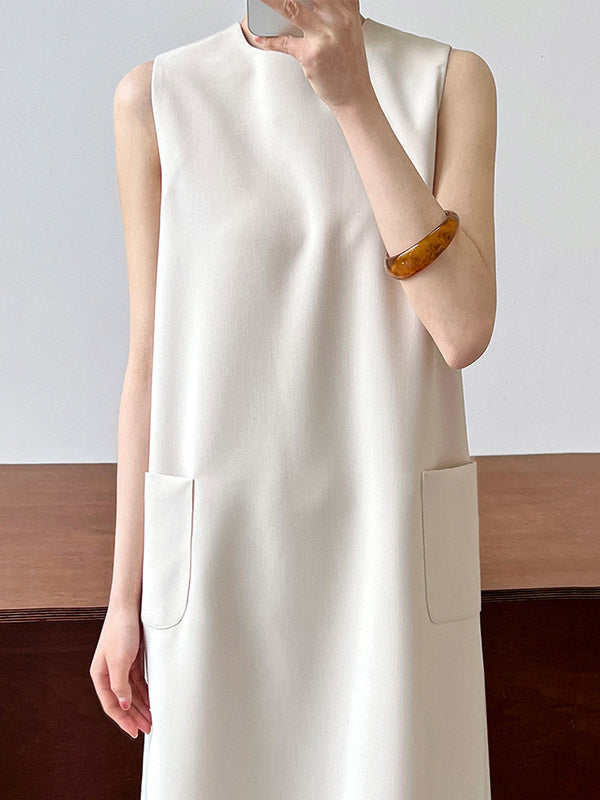 Robe mi-longue ample fendue dans le dos taille haute, à poches, à fermeture éclair, à col rond, couleur unie