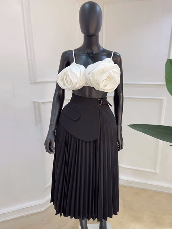 Jupe asymétrique plissée coupe trapèze, taille haute, à empiècements, couleur unie