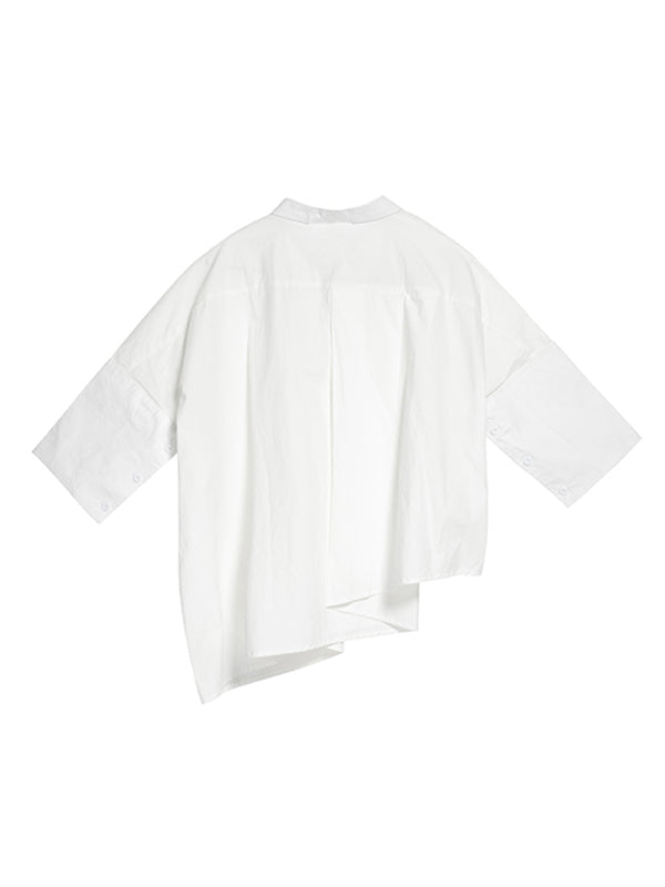 Blouse unie à coupe irrégulière et col revers