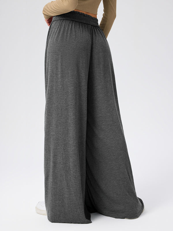Pantalon ample plissé taille haute, à poches, à empiècements, couleur unie