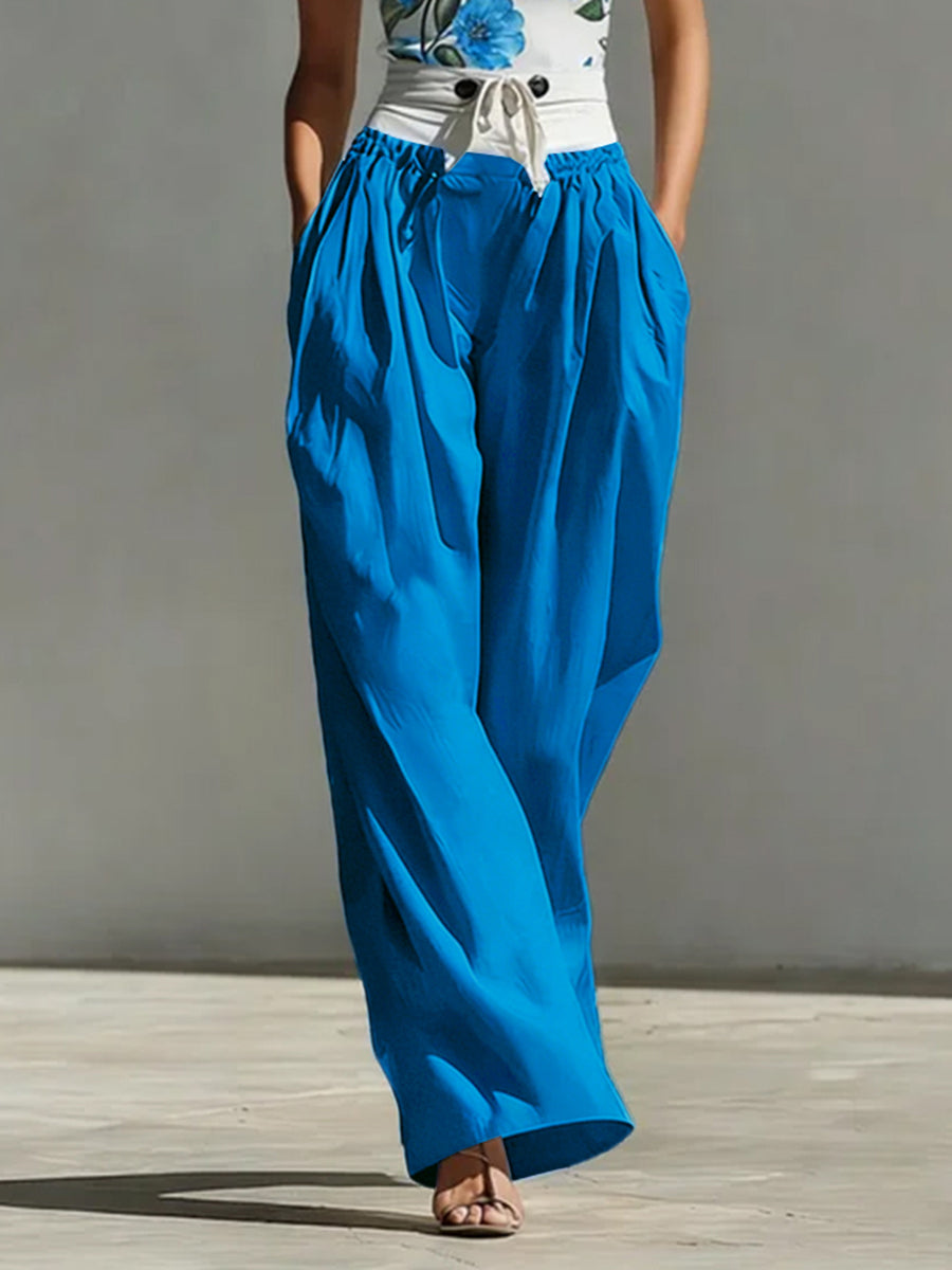Pantalon boutonné plissé taille haute, à jambes larges, à poches, à empiècements, à taille nouée, couleur contrastée