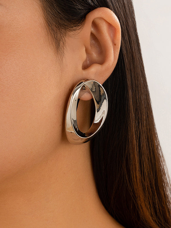 Boucles d'oreilles asymétriques brillantes couleur unie