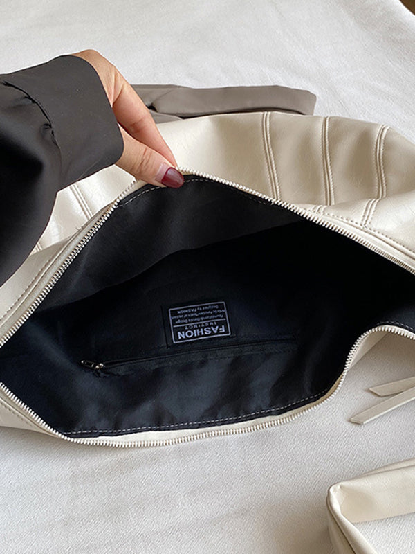 Sac bandoulière géométrique à empiècements, à fermeture éclair