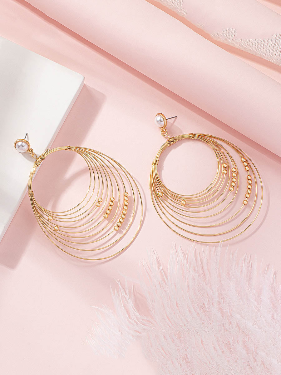 Boucles d'oreilles géométriques à coupe irrégulière