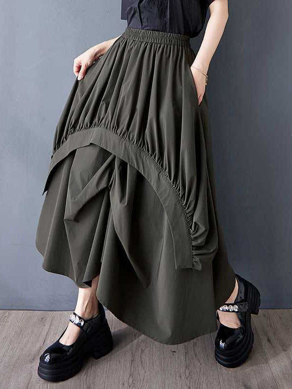 Jupe ample asymétrique plissée coupe trapèze, à taille élastique, à poches, couleur unie