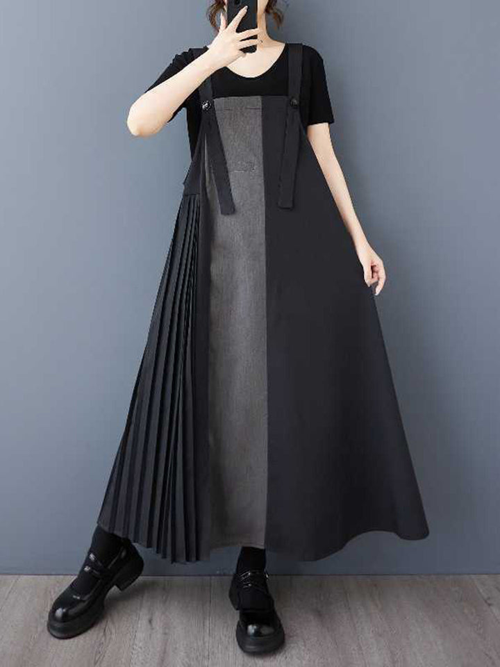 Robe mi-longue ample asymétrique boutonnée plissée coupe trapèze, à poches, à empiècements, à bretelles réglables, couleur contrastée