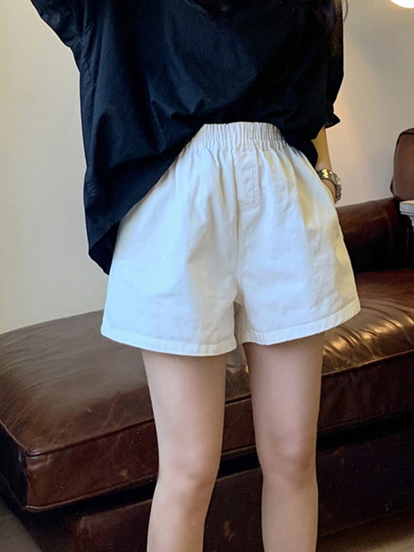 Short ample taille haute, à taille élastique, à empiècements, couleur unie
