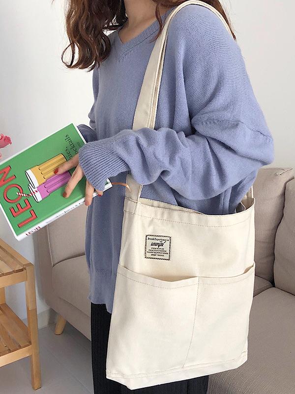Sac à main simple en toile de couleur unie avec poches