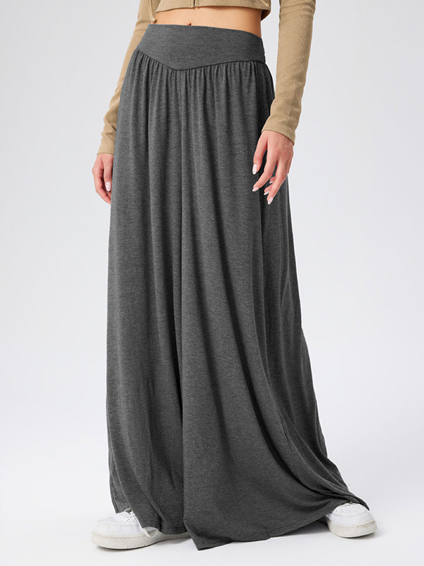 Pantalon ample plissé taille haute, à poches, à empiècements, couleur unie