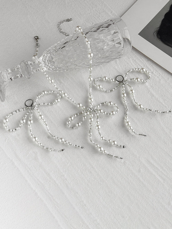 Parure boucles d'oreilles pendantes et collier à nœud