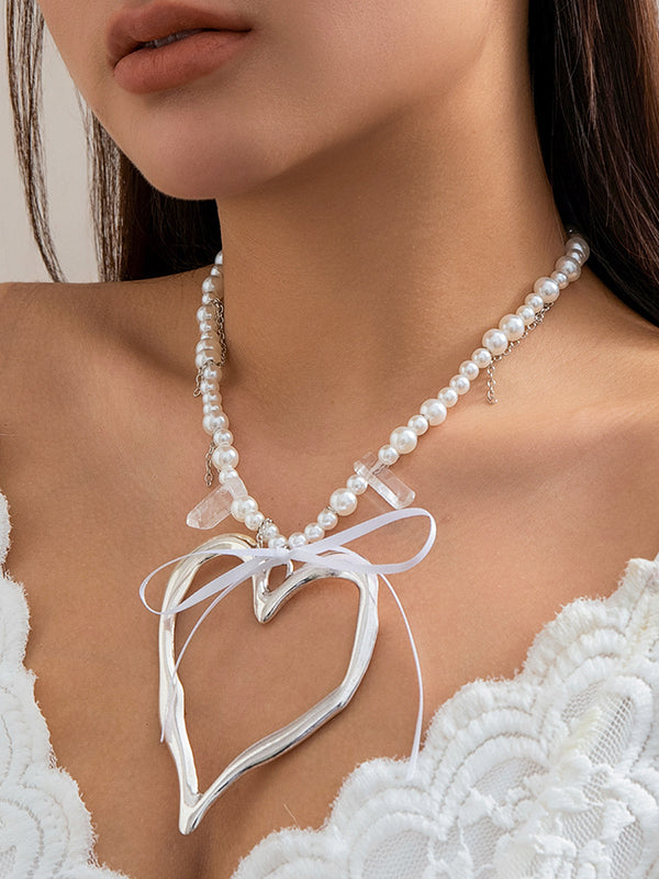 Collier perlé délicat en forme de cœur