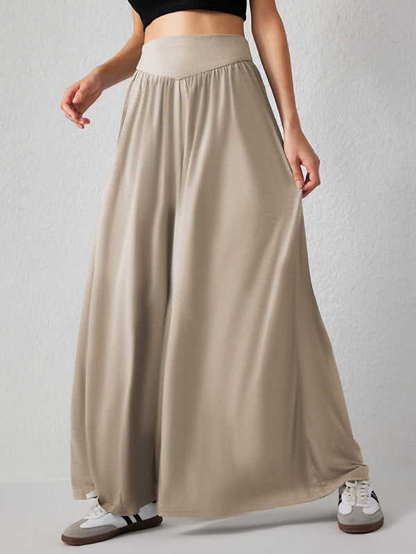 Pantalon ample plissé taille haute, à poches, à empiècements, couleur unie