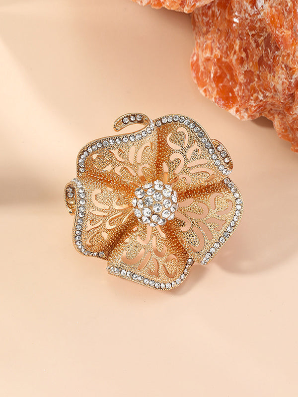Bague réglable ajourée en forme de fleur, à strass