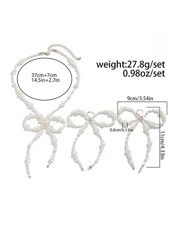 Parure boucles d'oreilles pendantes et collier à nœud