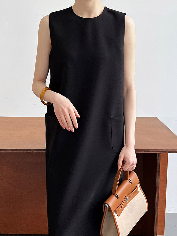 Robe mi-longue ample fendue dans le dos taille haute, à poches, à fermeture éclair, à col rond, couleur unie