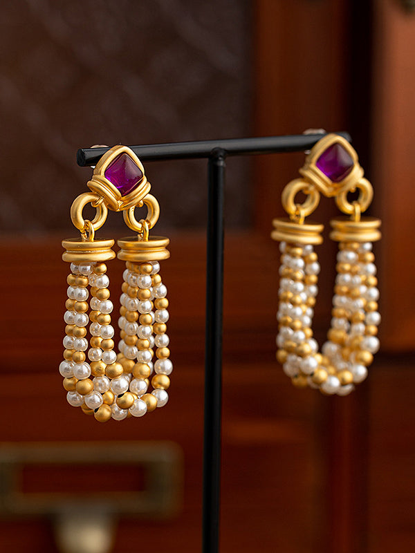 Boucles d'oreilles pendantes géométriques à pompons