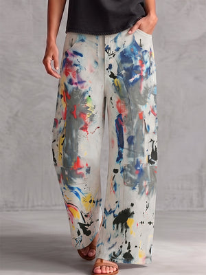 Bas de pantalon en Jean taille haute, jambe large, boutonné, couleur contrastée, poches imprimées graffitis