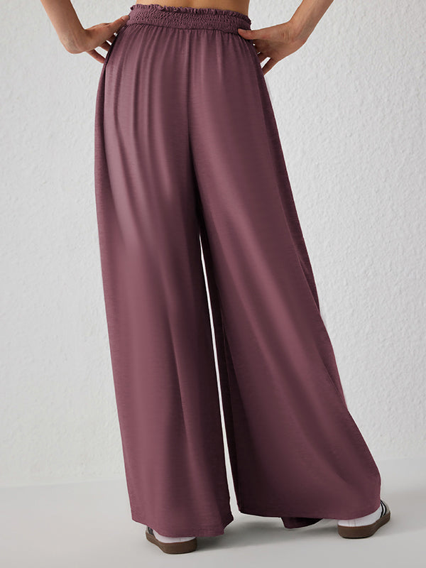 Pantalon ample plissé taille haute, à poches, à empiècements, couleur unie