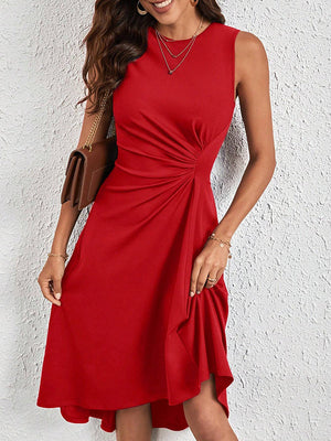 Robe mi-longue asymétrique plissée coupe trapèze, taille haute, à empiècements, à col rond, couleur unie