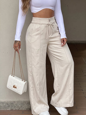Pantalon ample à poches, à taille élastique, à jambes larges, couleur unie