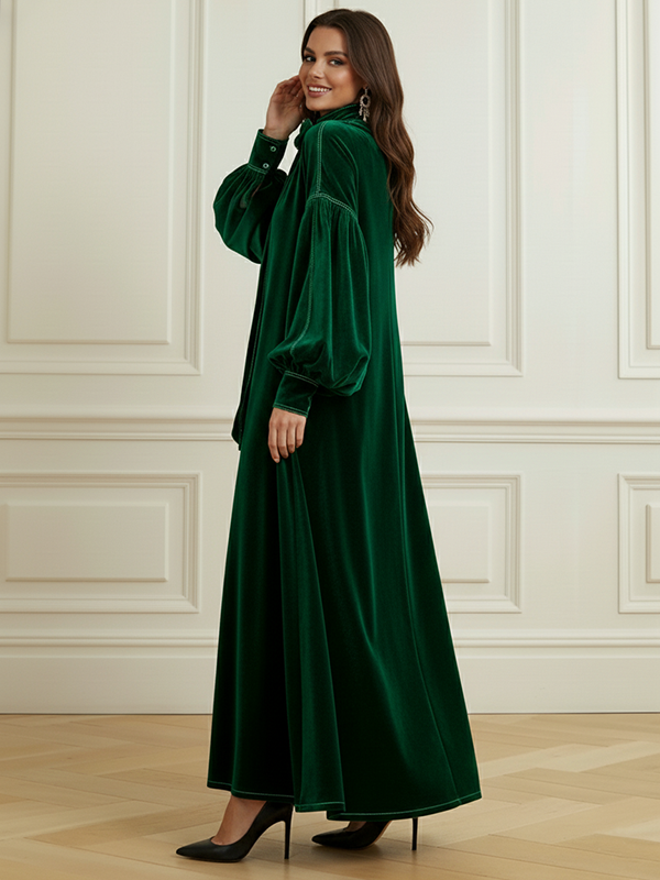 Robe longue plissée coupe trapèze, à manches longues, à nœud, à empiècements, à col haut, couleur unie