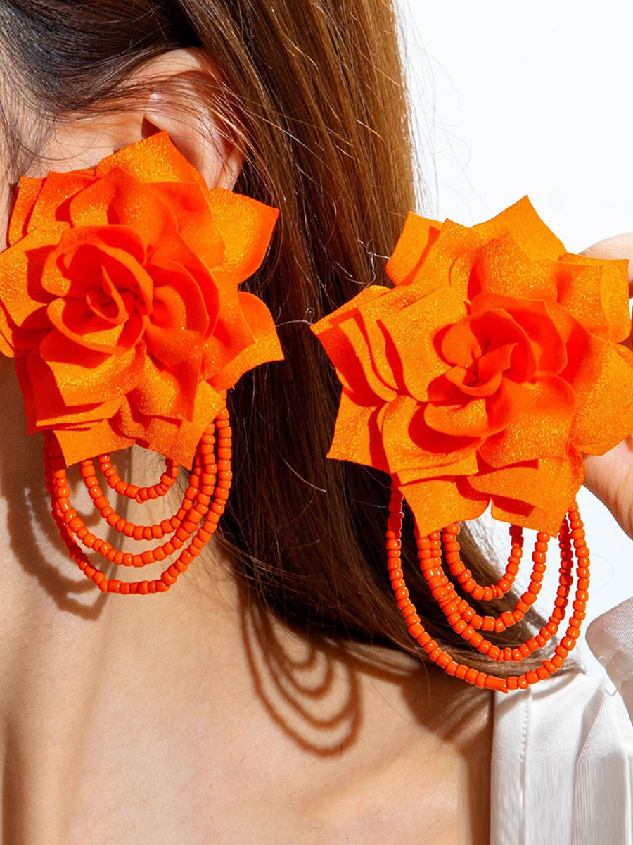 Boucles d'oreilles pendantes en forme de fleur, à pompons