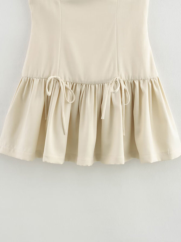 Robe courte ample plissée coupe trapèze, à empiècements, à fermeture éclair, à col rond, couleur unie