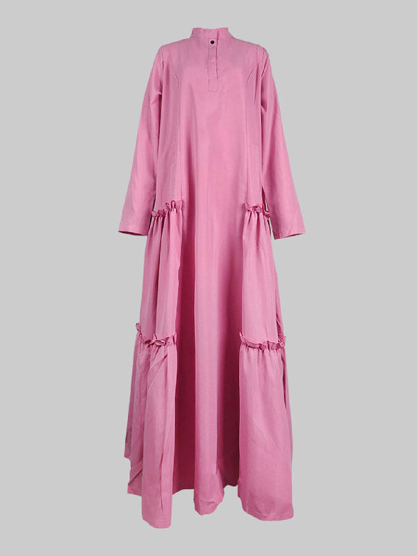 Robe longue boutonnée superposée plissée volantée coupe trapèze, à manches longues, à poches, à empiècements, à col montant, couleur unie