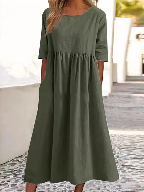 Robe mi-longue plissée coupe trapèze, à manches mi-longues, à poches, à col rond, couleur unie