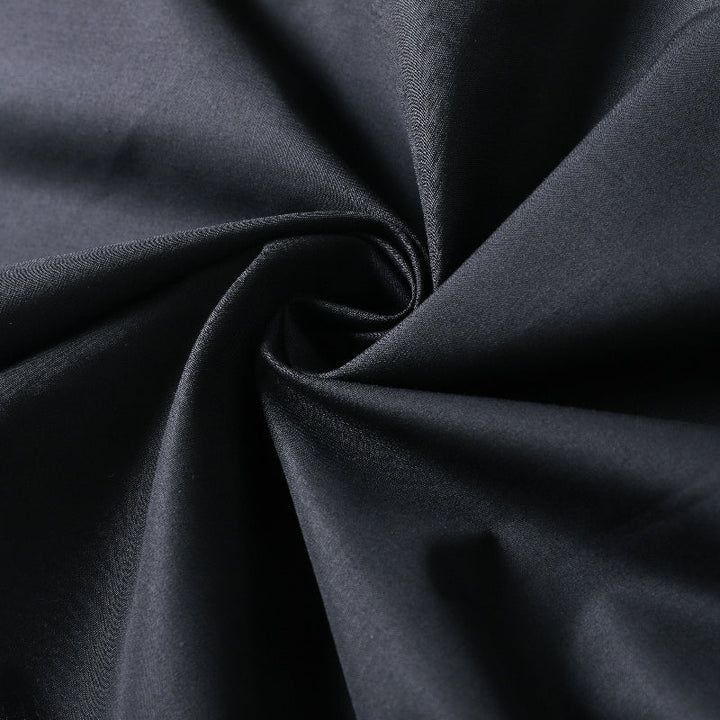 Jupe longue coupe trapèze, taille haute, à falbalas, couleur unie