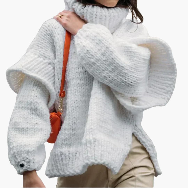 Pull femme avec col roulé oversize et ourlet côtelé