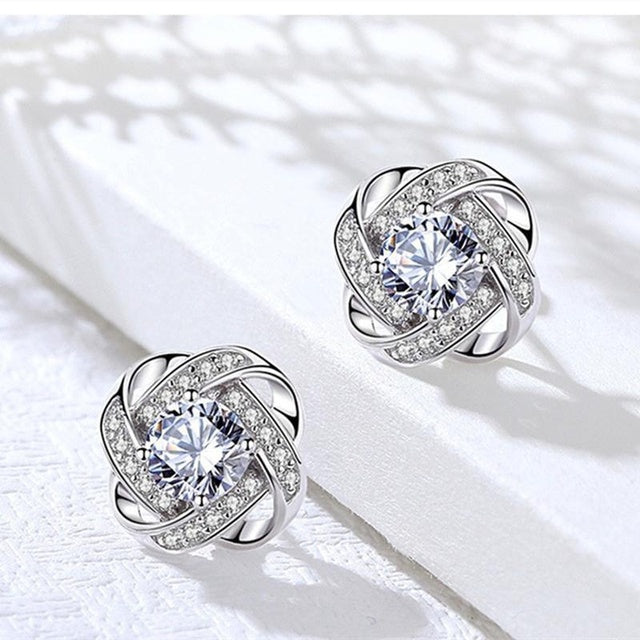 Boucles d'oreilles en croix spirale de fleurs