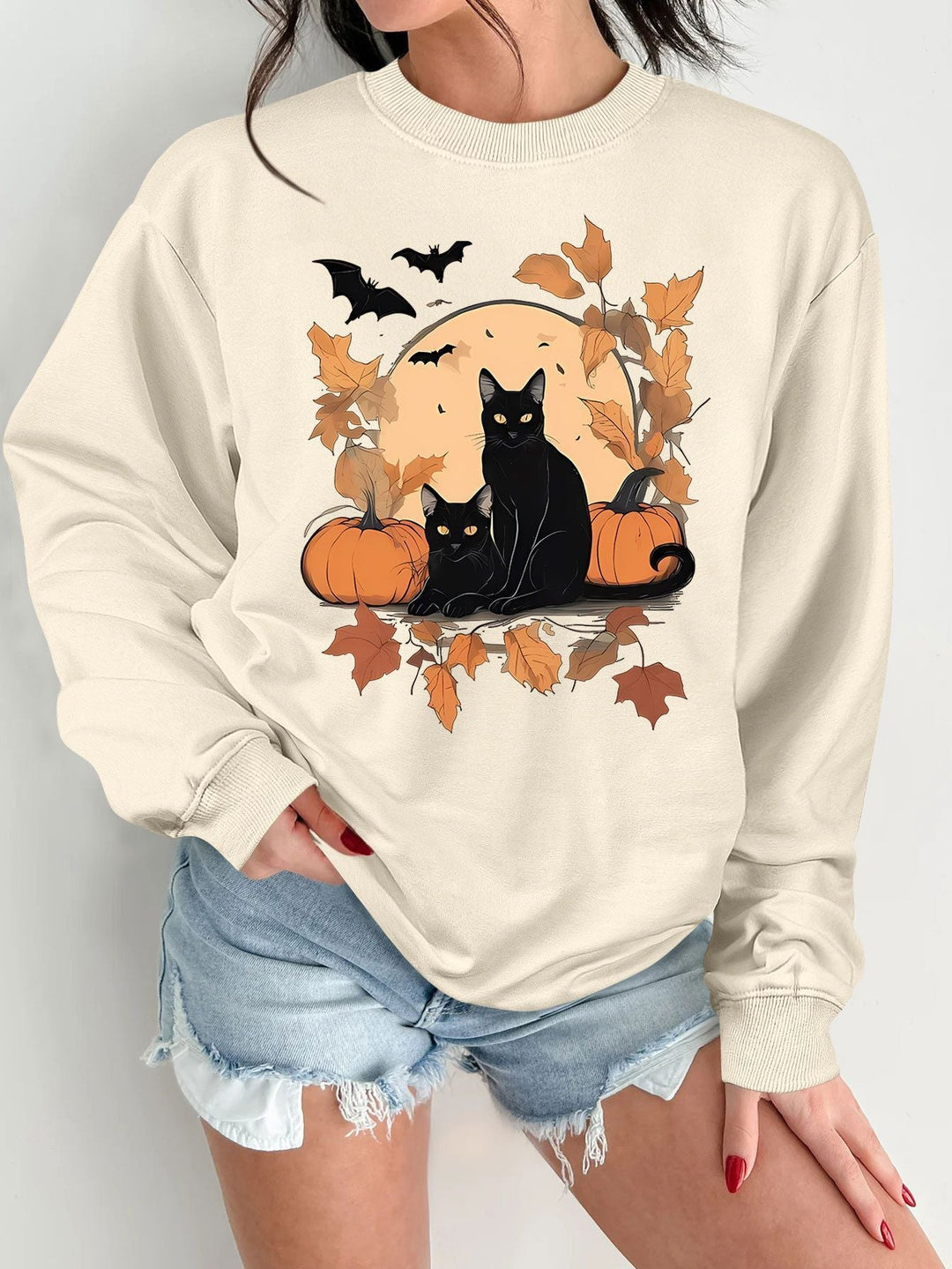Sweatshirt pour femmes avec un design automnal de chats et de citrouilles