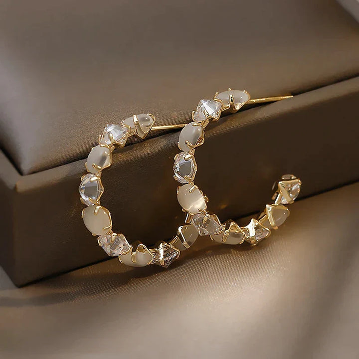 Boucles d'oreilles en or avec opale blanche et zircon