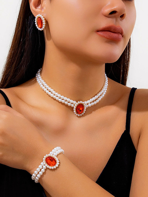 Parure collier et boucles d'oreilles géométrique superposée à strass