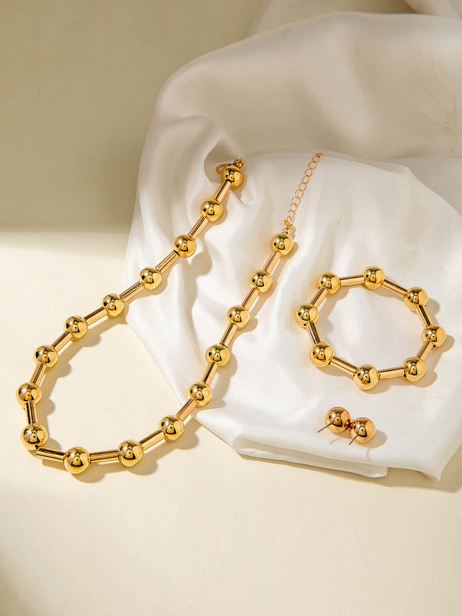 Parure collier et boucles d'oreilles géométrique couleur unie