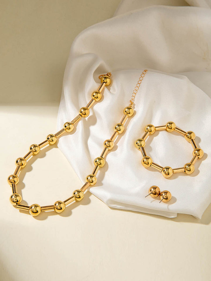 Parure collier et boucles d'oreilles géométrique couleur unie
