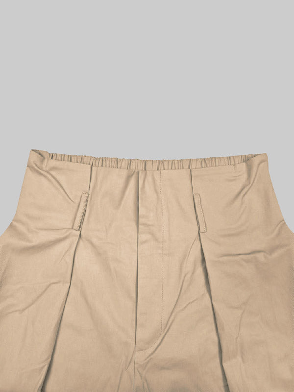 Pantalon ample plissé taille haute, à empiècements, couleur unie